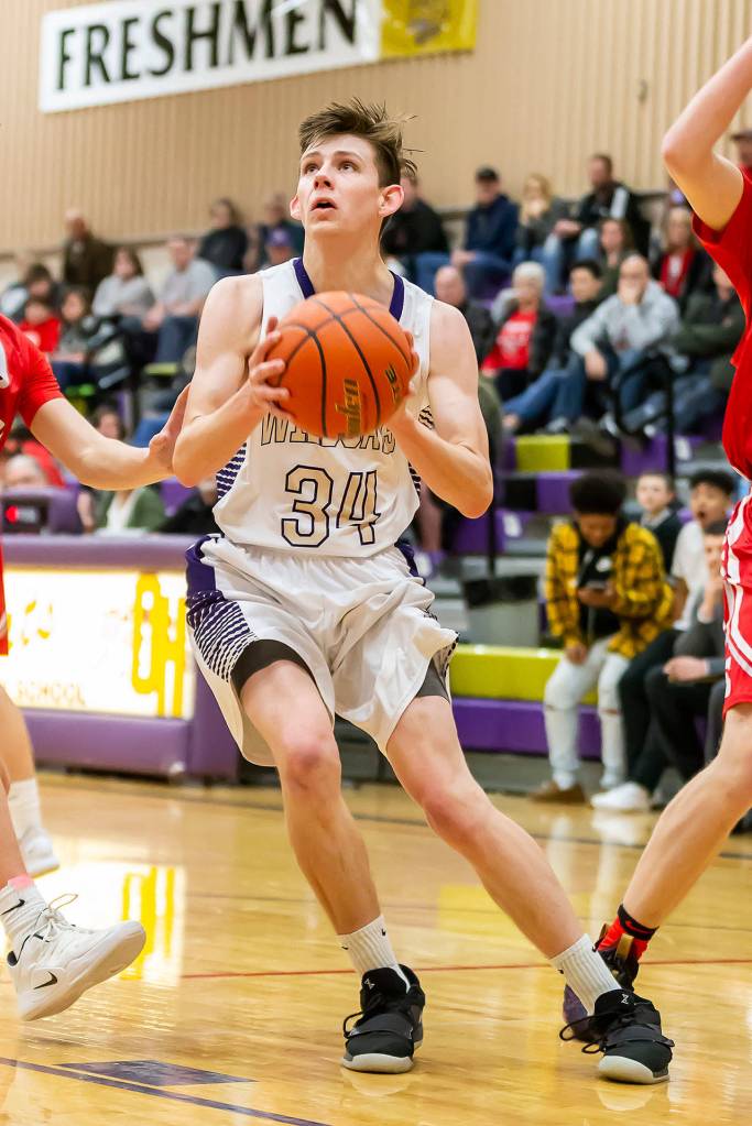 Kevin Schuldt gathers to go to the hoop.(Photo by John Fisken)