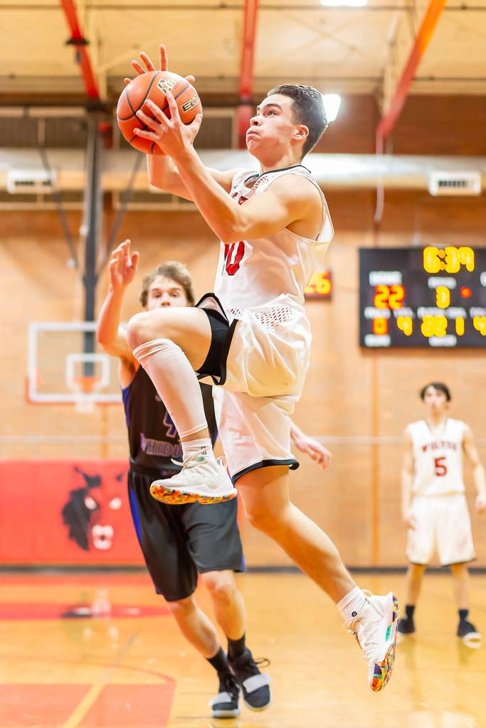 Sean Toomey-Stout explodes to the basket for the Wolves.(Photo by John Fisken)