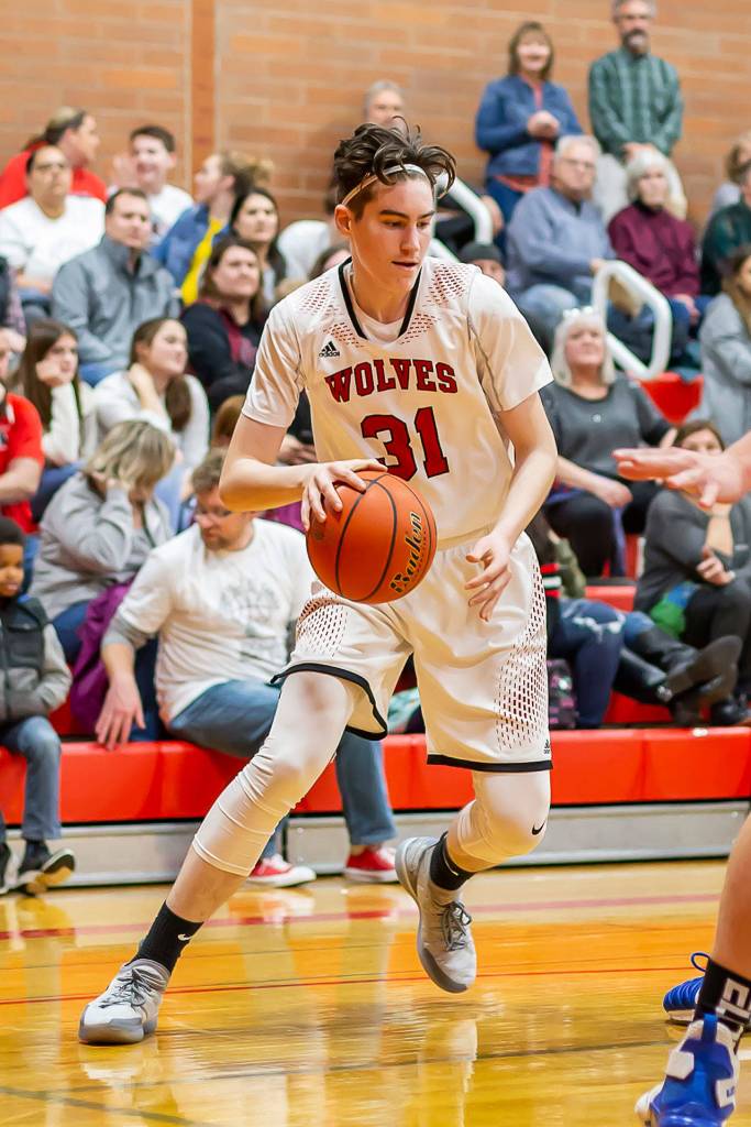 Ulrik Wells looks to attack the Falcon defense.(Photo by John Fisken)