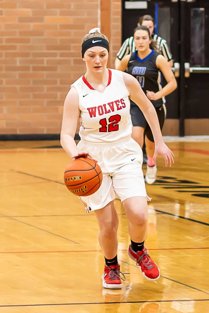 Anya Leavell advances the ball for the Wolves.(Photo by John Fisken)