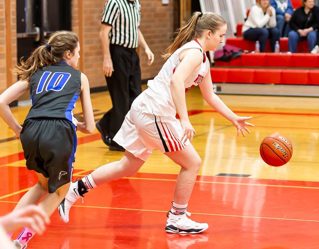 Izzy Wells starts the Coupeville break ahead of South Whidbeys Bella Pierce (10).(Photo by John Fisken)