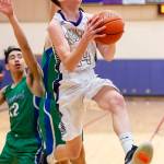 Kevin Schuldt goes to rim to give Oak Harbor a 10-point lead.(Photo by John Fisken)