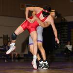 Oak Harbors Vernados Barber, right, tries to throw M-Ps Nick Cantu. (Photo by John Fisken)