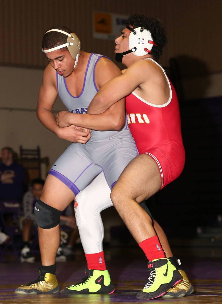 Noah Hangan, left, attempts to escape the grasp of Tomahawk Ahmad Humoud.(Photo by John Fisken)