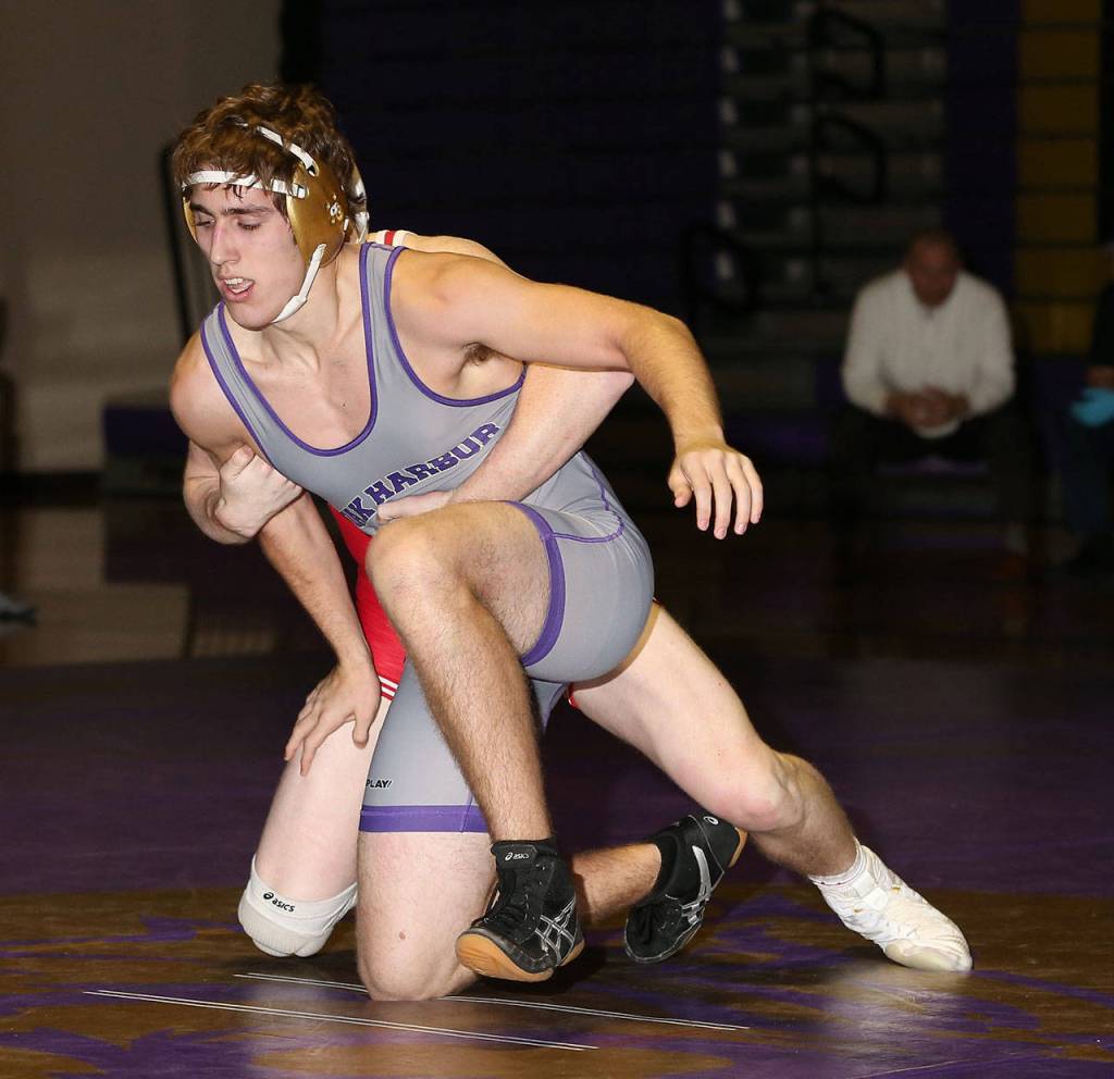 Ethan Pace, left, tries to escape from Marysville-Pilchucks Cayden White.(Photo by John Fisken)