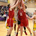 Dorian Hardin (white jersey) battles for a rebound with three Panthers  Kolton Smith, left, Tayte Conover and Grady Kentch (32).(Photo by John Fisken)