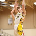 Kevin Schuldt rips down a rebound for the Wildcats.(Photo by John Fisken)