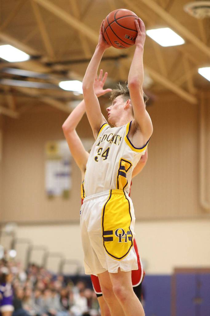 Kevin Schuldt rips down a rebound for the Wildcats.(Photo by John Fisken)