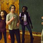 From left, Wanda Ducheneaux, Lilly Borowy, Jaiden Harper and Amaya Patterson dance in the corner of the gym floor of the Roller Barn. Photo by Laura Guido/Whidbey News-Times