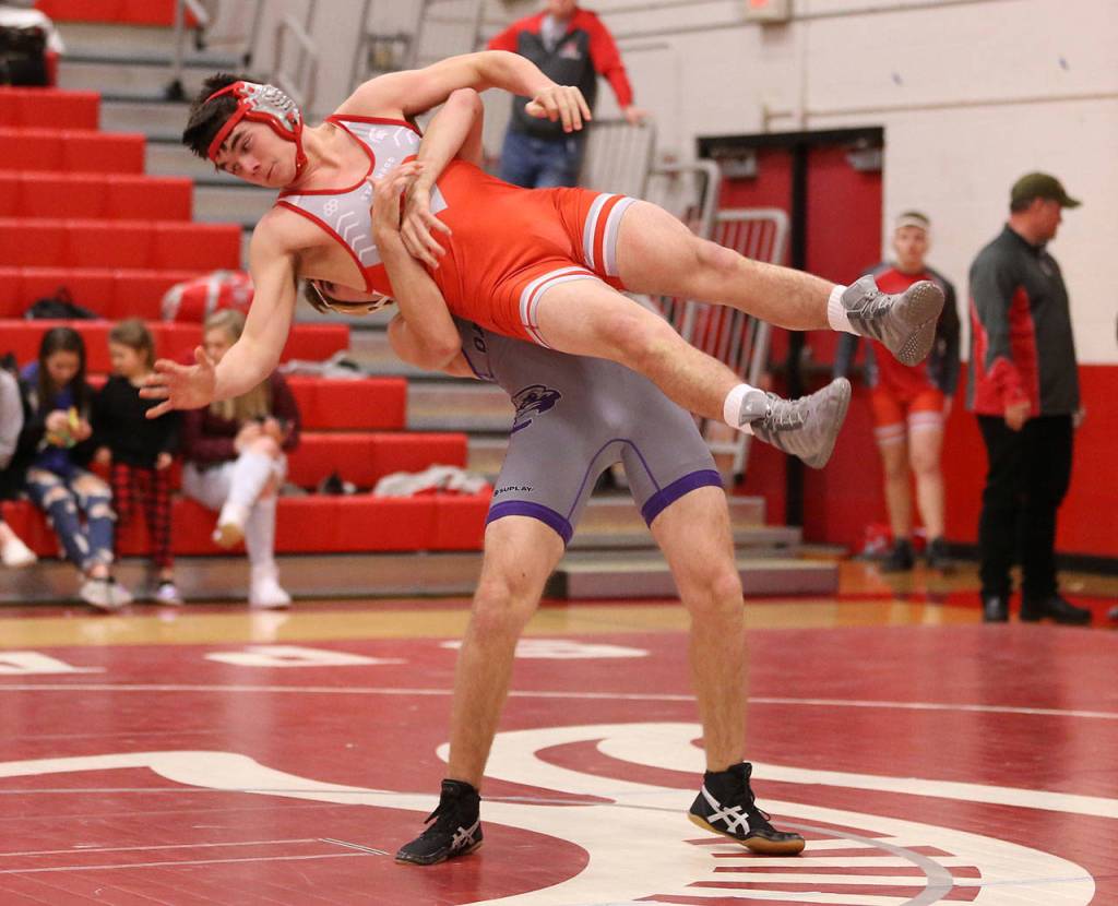 Ethan Pace throws his Stanwood opponent. Pace won the match by injury default.(Photo by John Fisken)