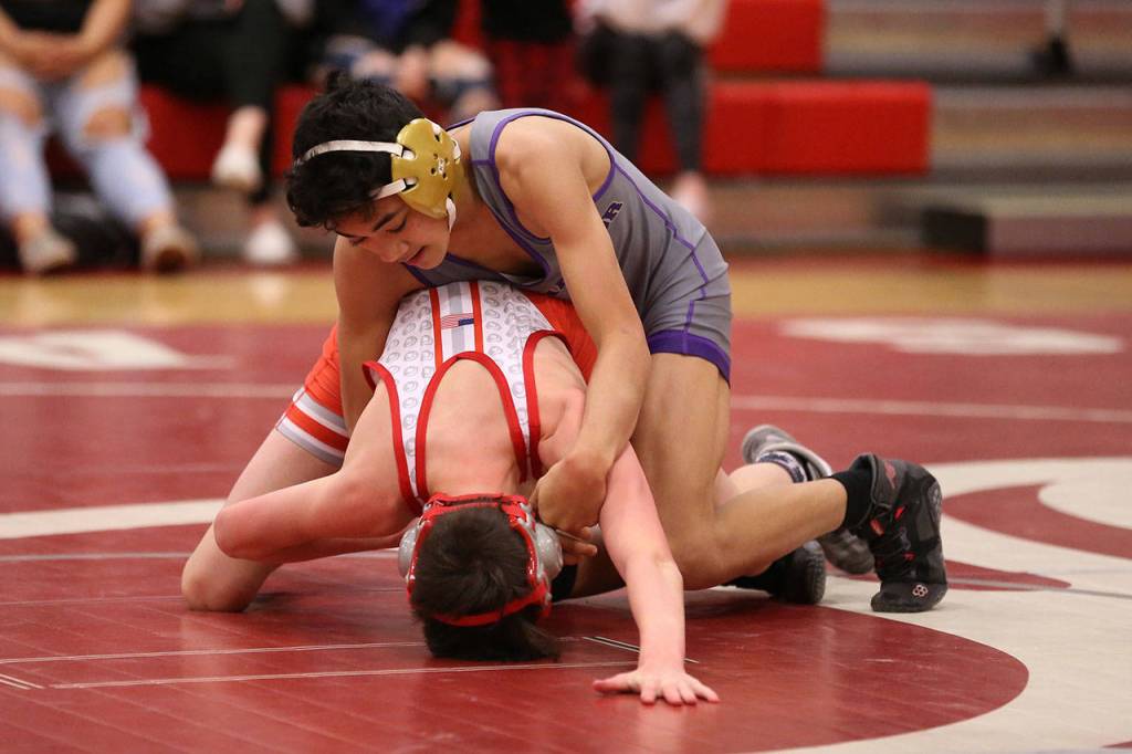 Cole Valdez, top, works his way to a 10-2 win.(Photo by John Fisken)