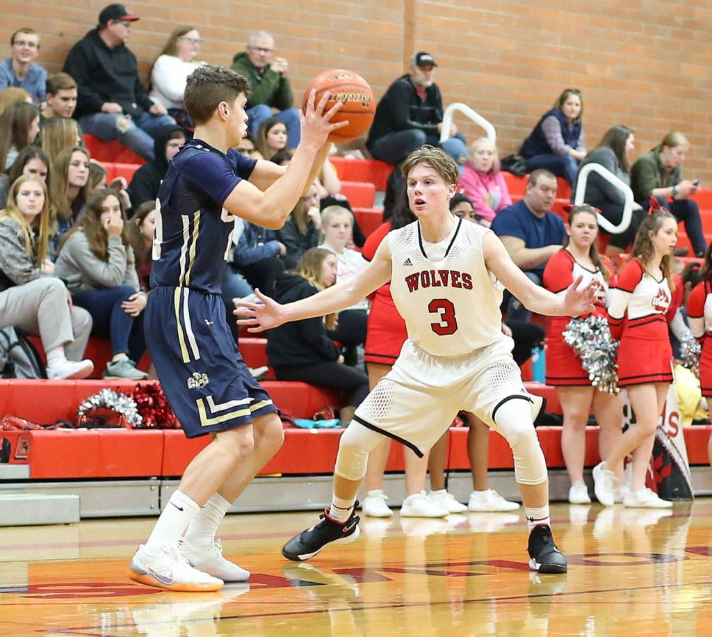 Mason Grove, right, applies pressure during Coupevilles press.(Photo by John Fisken)