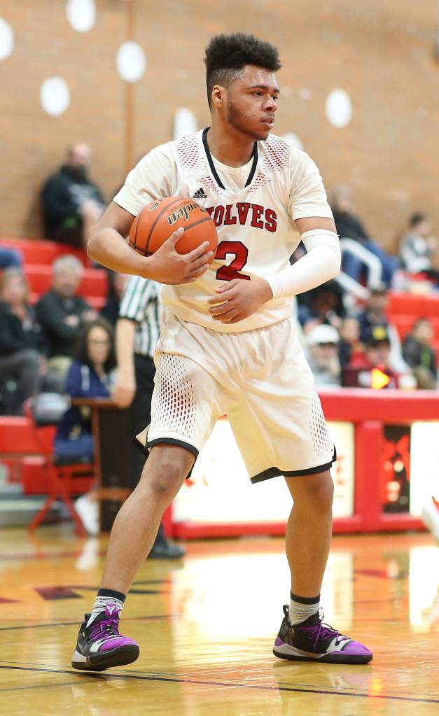 Jakobi Pilgrim protects the ball after grabbing a rebound.(Photo by John Fisken)