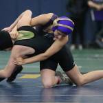 Oak Harbors Isabella Moss, top, tries to turn Flynn Larson of Bellingham.(Photo by John Fisken)