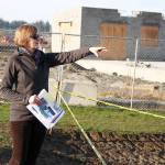 Ellen White, a fundraising chairwoman for the Bailey Johnson Playground Improvement Committee, explains the new planned layout for the updated playground commemorating a 4-year-old Oak Harbor girl who died in 2002. The toddler play area will open with the re-opening of Windjammer Park in July. Photo by Laura Guido/Whidbey News-Times