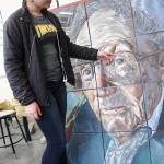 Senior Allison Jungmann and her piece Eyes for the Ocean, which qualified for the national Scholastic Art Competition. Photo by Laura Guido/Whidbey News-Times