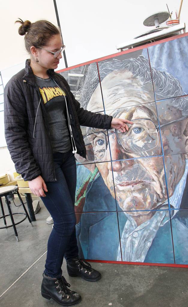 Senior Allison Jungmann and her piece Eyes for the Ocean, which qualified for the national Scholastic Art Competition. Photo by Laura Guido/Whidbey News-Times
