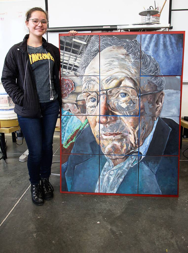 Senior Allison Jungmann and her piece Eyes for the Ocean, which qualified for the national Scholastic Art Competition. Photo by Laura Guido/Whidbey News-Times