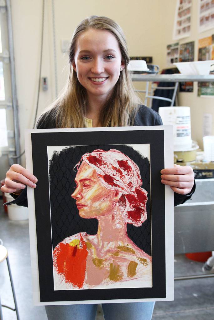 Junior Cherie Miller and her piece Happy Accidents. Miller was one of five gold-key winners from Oak Harbor High School in the state Scholastic Art Competition. Photo by Laura Guido/Whidbey News-Times