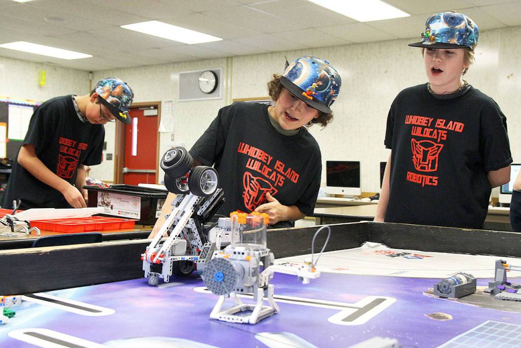 Left, Tobias Wood, and Austin Stephens watch as the robot appears to go off course as the two try and perfect their execution before the FIRST Lego League state competition on Feb. 10. Photo by Laura Guido/Whidbey News-Times