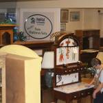 Volunteer Patti Olson checks out an unusual vintage kitchen hutch for sale at Oak Harbors Habitat for Humanity store. (Photos by Patricia Guthrie/Whidbey News Group)