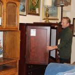 Store Director Tony Persson, new store director, looks over cabinets at the Oak Harbor Habitat for Humanity of Island County store. The organization is revamping its stores, image and community reach.