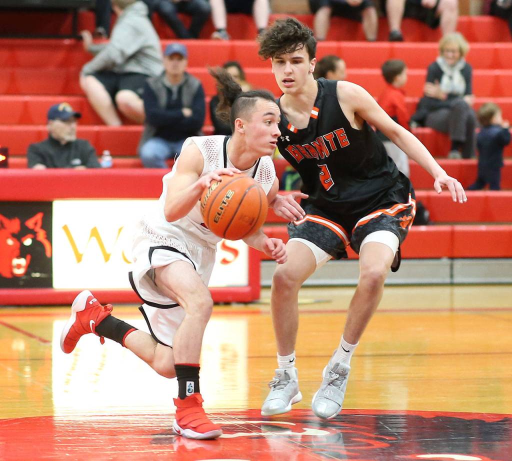 Coupevilles Jered Brown drives by Granite Falls Michael Burns.(Photo by John Fisken)
