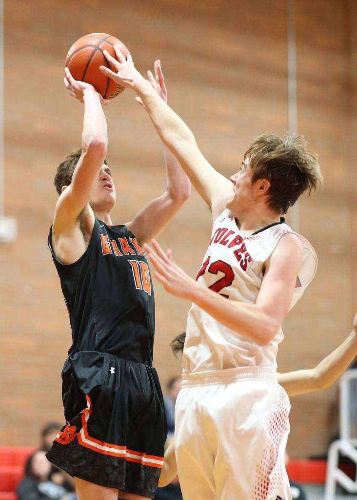 Gavin Knoblich blocks a shot by Granite Falls Ben Haider.(Photo by John Fisken)