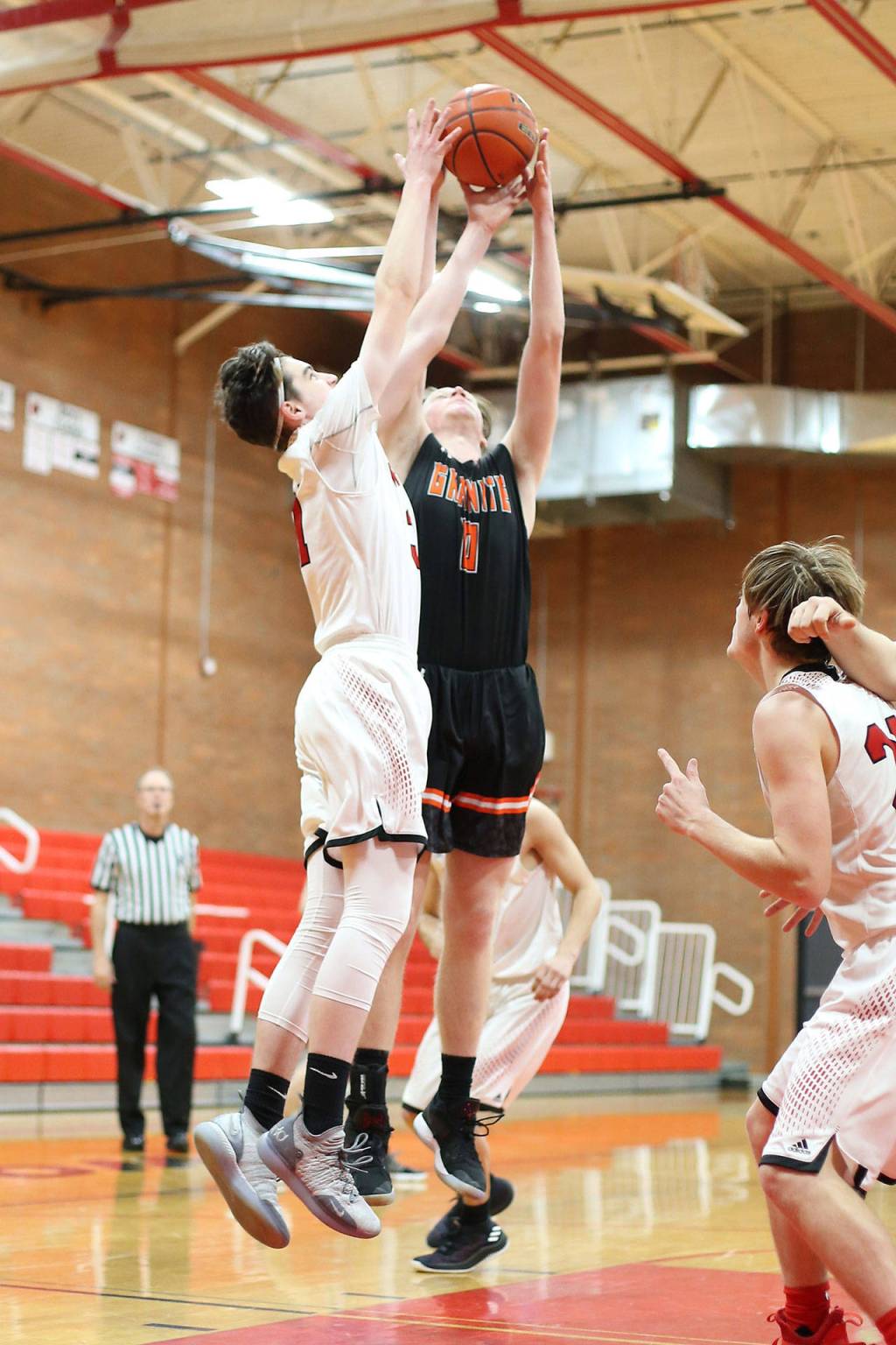 Ulrik Wells, left, battles for a rebound.(Photo by John Fisken)