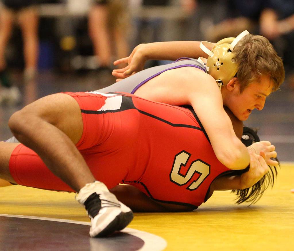 Oak Harbors Thibault Simorato, left, has his Snohomish opponent in trouble.(Photo by John Fisken)