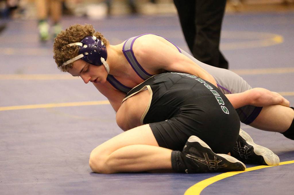 Oak Harbors Shamus Warden, top, works on Getchells Cody Mitchell.(Photo by John Fisken)