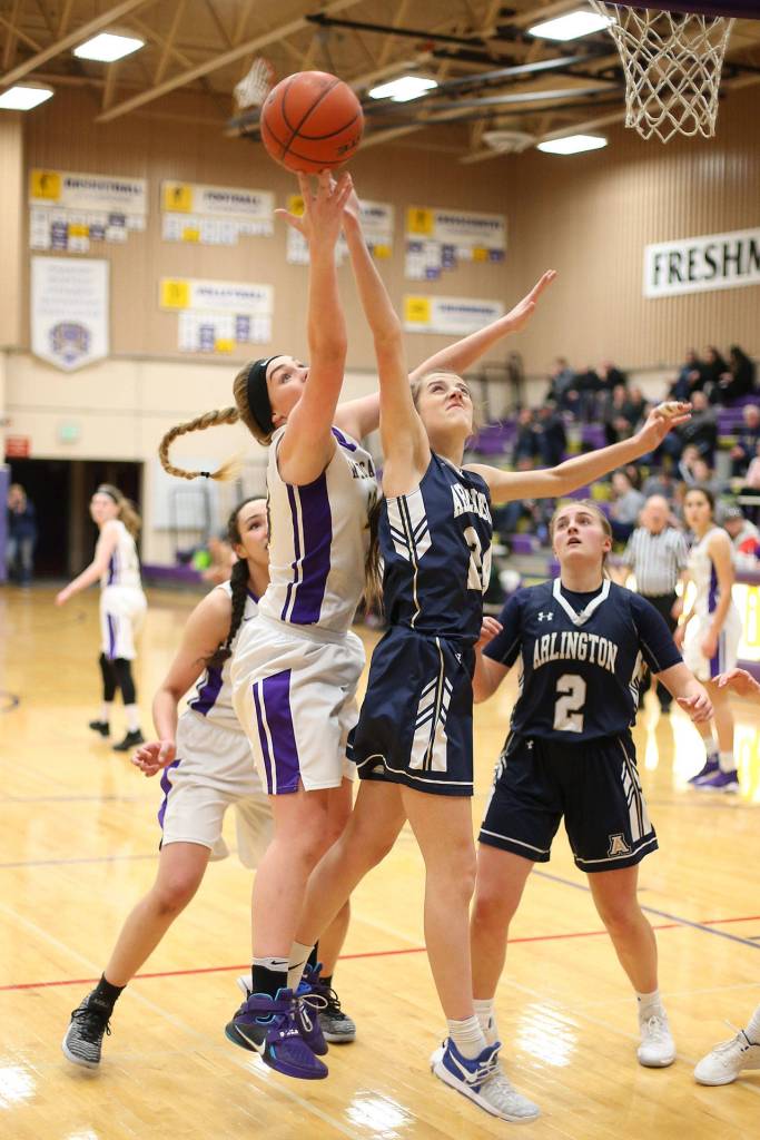 Oak Harbors Payton Parks, left, fights for a rebound.(Photo by John Fisken)