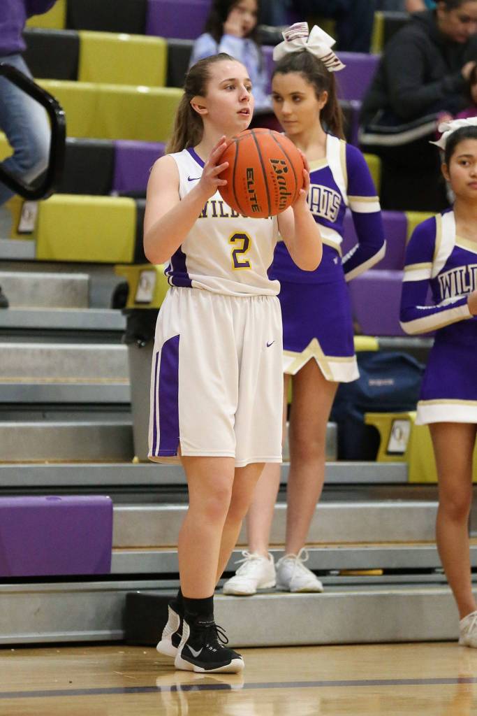 Monique Stolmeier inbounds the ball for the Wildcats.(Photo by John Fisken)
