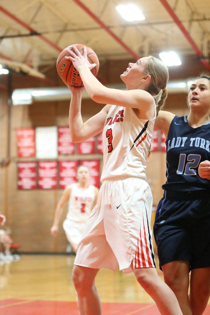Chelsea Prescott takes the ball to the basket for Coupeville.(Photo by John Fisken)