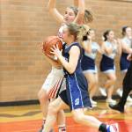 Coupevilles Tia Wurzrainer blocks the path of Sultans Lindsey Fleming.(Photo by John Fisken)