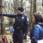 Officer Mel Lolmaugh, Oak Harbor Police Department, points out to Cynthia Besaw, county veterans resource coordinator, areas homeless individuals have been known to occupy in an area called The Pit off Goldie Road. He accompanied Besaw and other volunteers to the area during the annual Point in Time homeless population count in January. Photo by Laura Guido/Whidbey News-Times