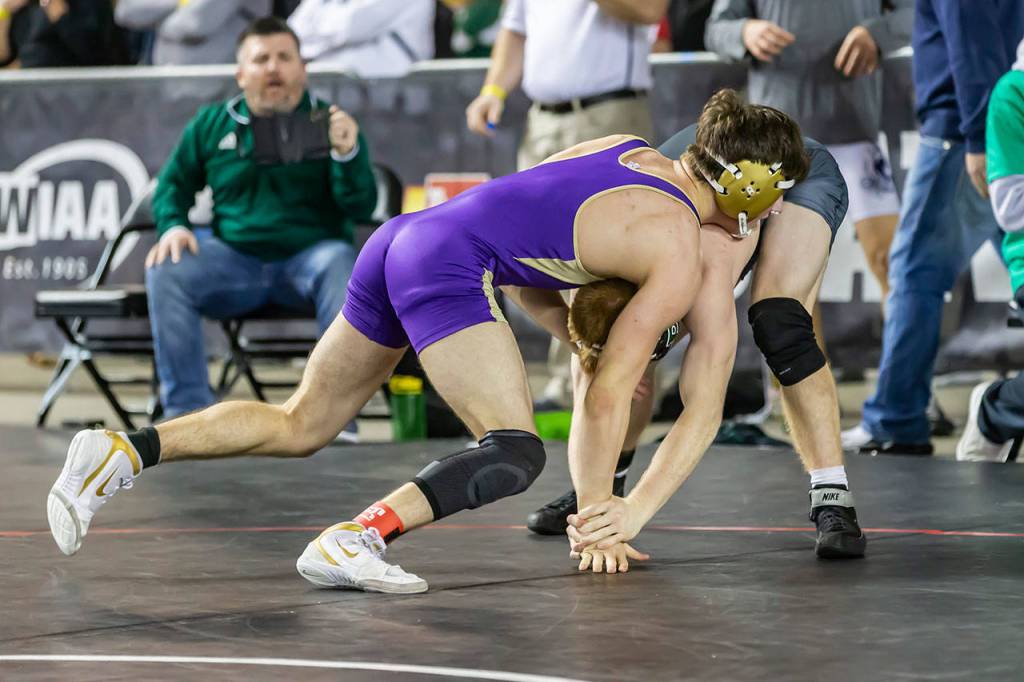 Oak Harbors Blake McBride, left, and Peninsulas Nathan Johnson. (Photo by John Fisken)