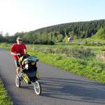 Craig Romano, author of a new outdoor recreation book on trails in the Everett area, runs on the Centennial Trail near the Nakashime Barn in Arlington. (Craig Romano)