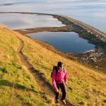 Photo by Craig Romano                                 Heather Romano hikes the Bluff Trail at Ebeys Landing Historical Reserve on Whidbey Island.