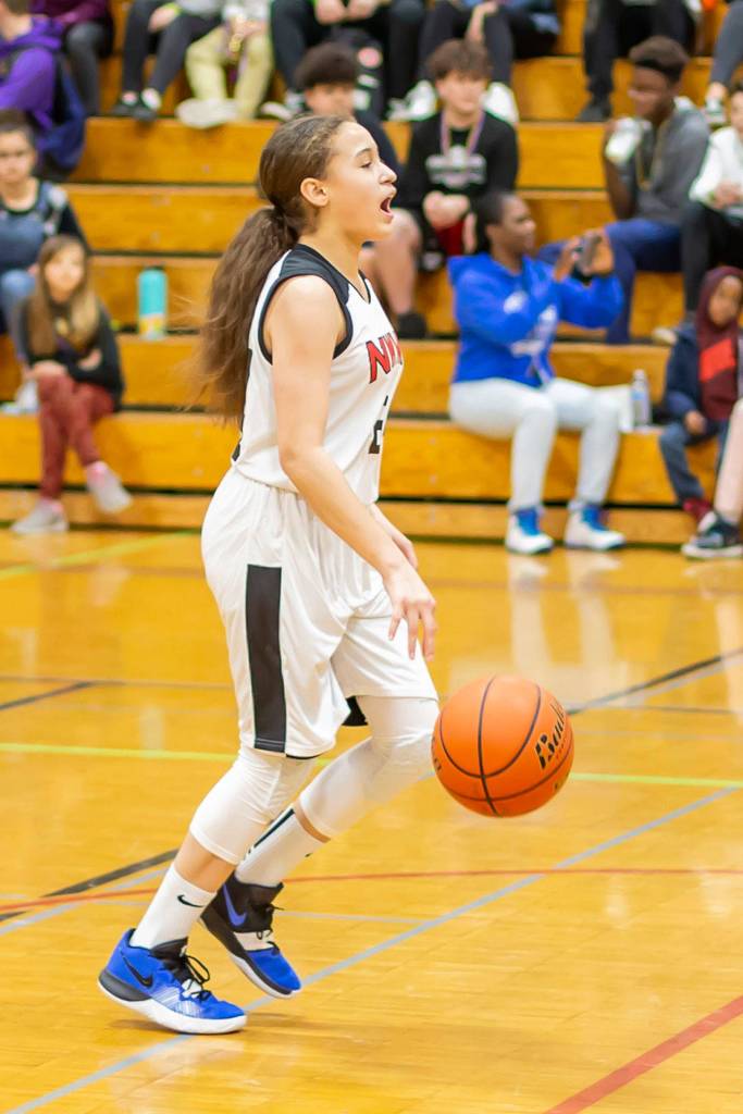 Seventh-grader Brainna Richard calls out a play.(Photo by John Fisken)
