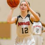 Claire Paul shoots a free throw for the seventh-grade Cougars.(Photo by John Fisken)