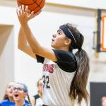Heidy Hurtado takes it to the hoop for the NWMS eighth-grade team.(Photo by John Fisken)