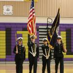 Shaina Aguirre, left, Taylor Kesler, Elaine Aguirre and Jasmine Schuldt march as Oak Harbors color guard No. 1.(Photo by John Fisken)
