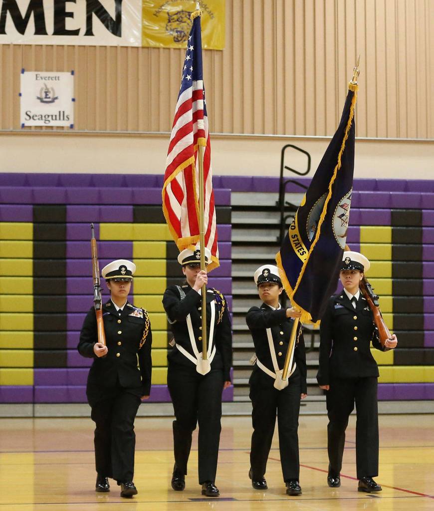 Shaina Aguirre, left, Taylor Kesler, Elaine Aguirre and Jasmine Schuldt march as Oak Harbors color guard No. 1.(Photo by John Fisken)
