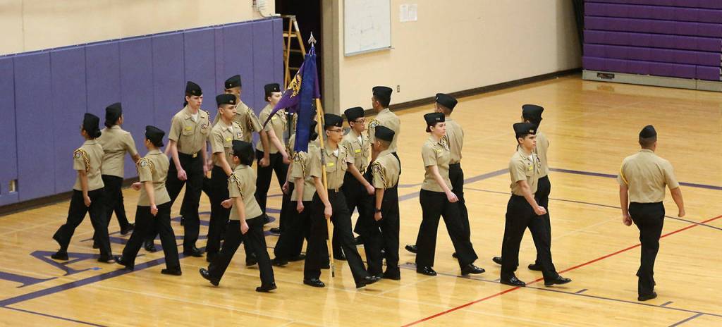 The gold unarmed drill team goes through maneuvers Saturday.(Photo by John Fisken)