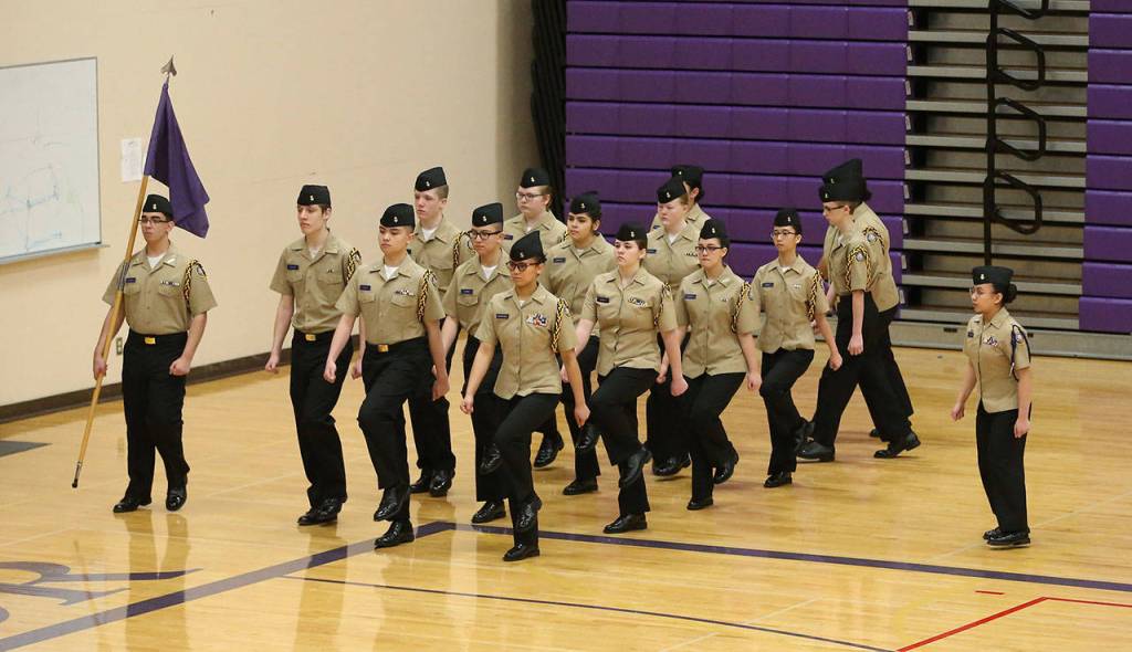 The Oak Harbor purple unarmed drill team marches Saturday.(Photo by John Fisken)