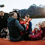 Andy Baldridge and Erica Saar-Baldridge and their children on a boat with a crew from HGTVs House Hunters International. The couple decided to move to the Patagonia region of Argentina in December 2017. Photo by Brianne Belle