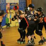 Tina Bond, Jennifer Garlington, Misty Awbrey-Ford and Nic ONeill set up a roadblock for the Bunnies jammer. (Photo by Jim Waller/Whidbey News-Times)
