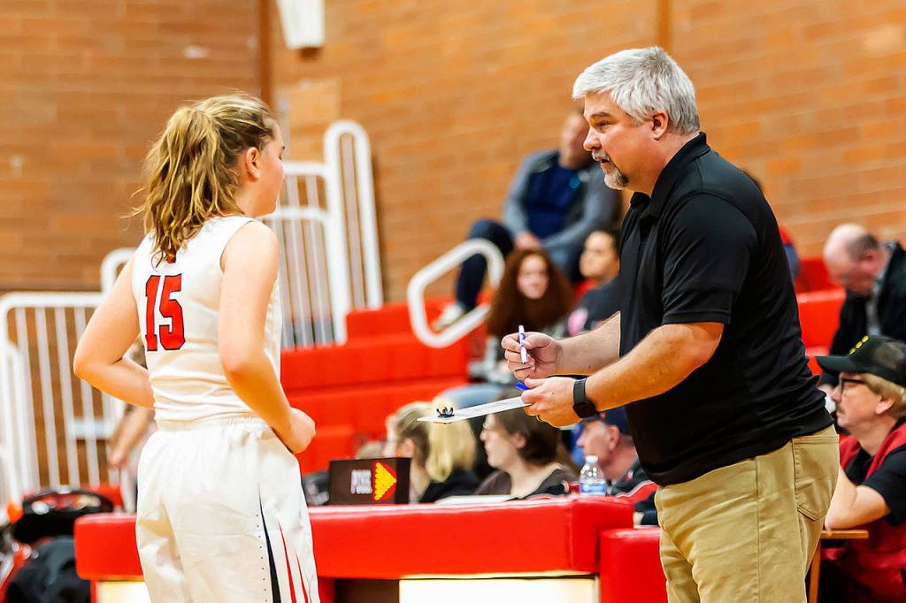 David King goes over some adjustments with Tia Wurzrainer.(Photo by John Fisken)