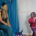Nymphaea the mermaid sparked the curiosity of children who visited the Masonic Lodge during Musselfest last weekend. Known off-duty as Stella Rowan, she answered questions and took photos with children including Bergen OFolan, age 3. (Photo by Maria Matson/Whidbey News -Times)